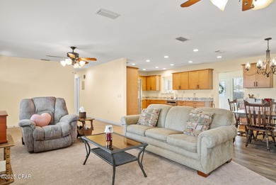 Welcome to this charming 2-bedroom, 2-bath home on a half-acre