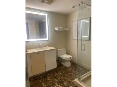 Welcome to Unit 1215 at The Q Club, a luxury condo-hotel