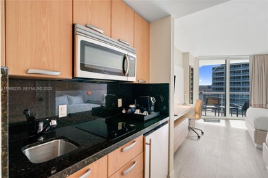 Welcome to Unit 1215 at The Q Club, a luxury condo-hotel