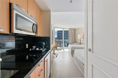 Welcome to Unit 1215 at The Q Club, a luxury condo-hotel