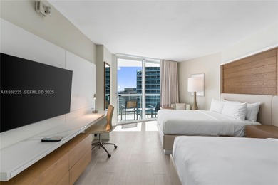 Welcome to Unit 1215 at The Q Club, a luxury condo-hotel