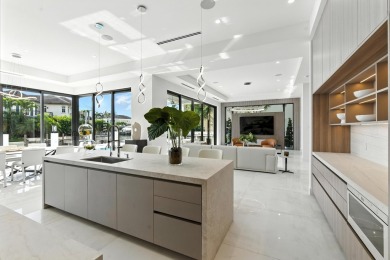 This extraordinary two-story waterfront estate is purpose-built