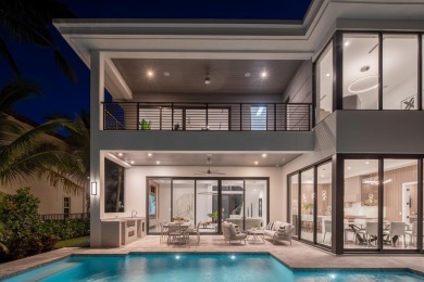 This extraordinary two-story waterfront estate is purpose-built