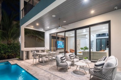 This extraordinary two-story waterfront estate is purpose-built