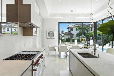 This extraordinary two-story waterfront estate is purpose-built