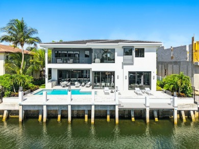 This extraordinary two-story waterfront estate is purpose-built