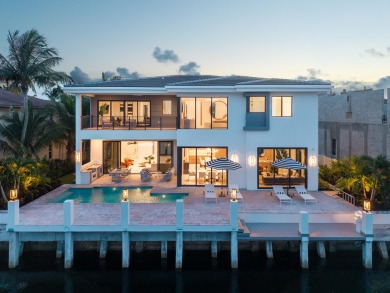 This extraordinary two-story waterfront estate is purpose-built