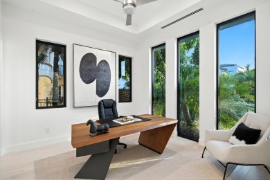 This extraordinary two-story waterfront estate is purpose-built