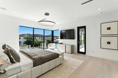 This extraordinary two-story waterfront estate is purpose-built