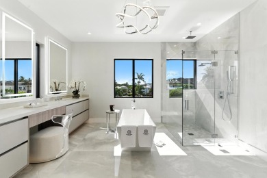 This extraordinary two-story waterfront estate is purpose-built