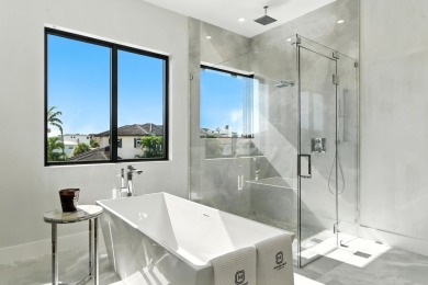 This extraordinary two-story waterfront estate is purpose-built