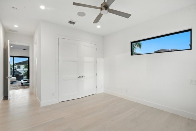 This extraordinary two-story waterfront estate is purpose-built