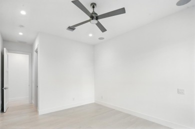 This extraordinary two-story waterfront estate is purpose-built