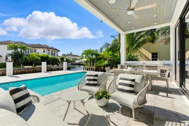 This extraordinary two-story waterfront estate is purpose-built