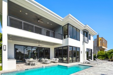 This extraordinary two-story waterfront estate is purpose-built