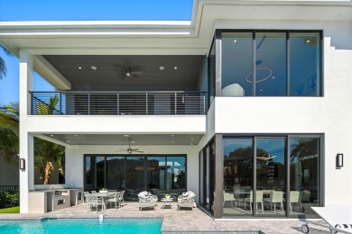 This extraordinary two-story waterfront estate is purpose-built