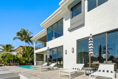 This extraordinary two-story waterfront estate is purpose-built