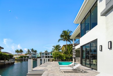 This extraordinary two-story waterfront estate is purpose-built