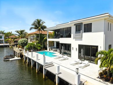 This extraordinary two-story waterfront estate is purpose-built