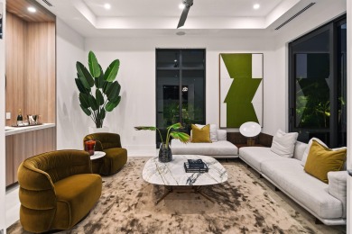 This extraordinary two-story waterfront estate is purpose-built