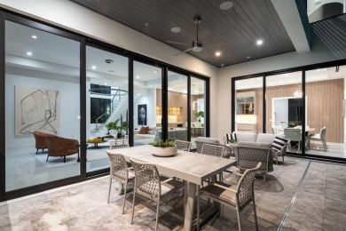 This extraordinary two-story waterfront estate is purpose-built