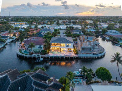 This extraordinary two-story waterfront estate is purpose-built