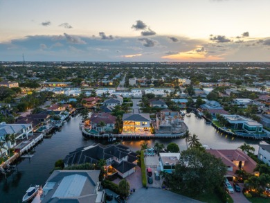 This extraordinary two-story waterfront estate is purpose-built