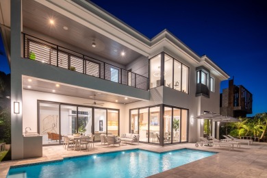 This extraordinary two-story waterfront estate is purpose-built