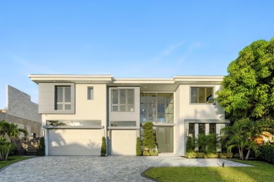 This extraordinary two-story waterfront estate is purpose-built