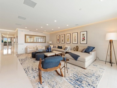 Live the Fisher Island lifestyle in this completely renovated