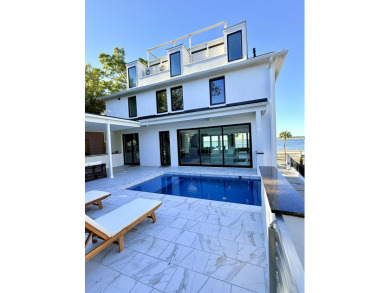 This remarkable contemporary residence on prestigious Murray