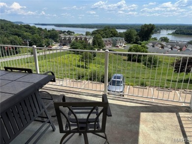 This one is ALL ABOUT THE VIEW !!!  This 2nd floor end unit has