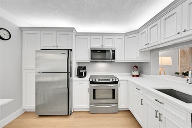 Discover luxury in this stunning ALL AGES  2nd-floor condo with