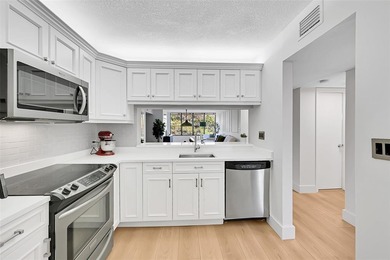 Discover luxury in this stunning ALL AGES  2nd-floor condo with