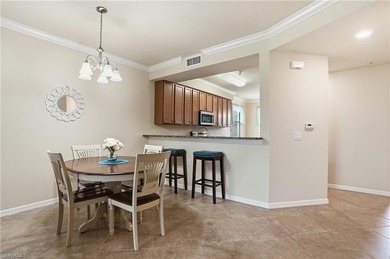 This rarely available second-floor end unit in Bonita National