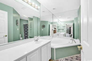 Spacious third-floor two-bedroom, two-bath condo located in an