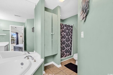 Spacious third-floor two-bedroom, two-bath condo located in an