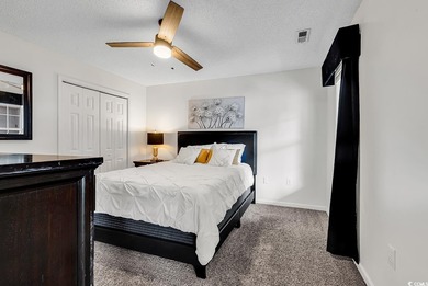 Spacious third-floor two-bedroom, two-bath condo located in an