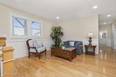 This stunning home is located in the highly desirable gated