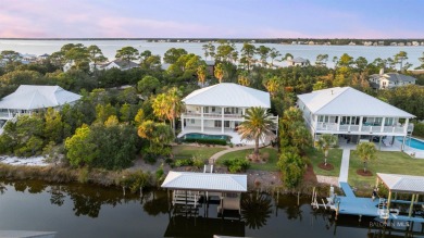 Stunning canal-front home on highly sought after Ono Island!