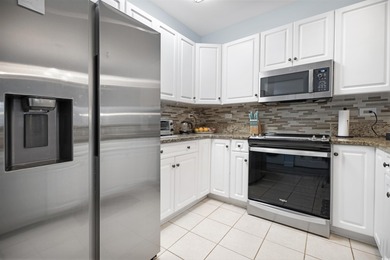 If you've been waiting for a fully renovated, first-floor condo