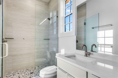 This new construction, six-bedroom, six-bathroom Gulf-front home