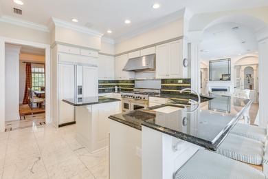 Timeless elegance on the bay behind the gates of prestigious