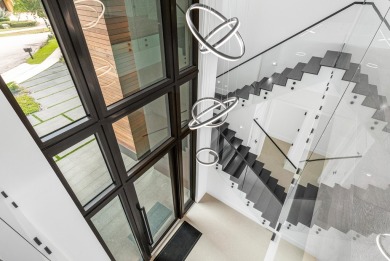 Welcome to 107 Bowsprit Dr, a waterfront masterpiece in a very