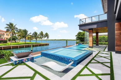 Welcome to 107 Bowsprit Dr, a waterfront masterpiece in a very