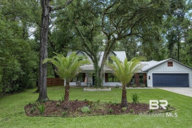 Located just one mile from downtown Fairhope, this 4BR/3.5BA