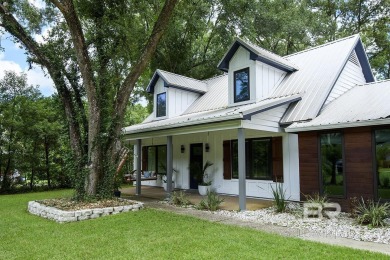 Located just one mile from downtown Fairhope, this 4BR/3.5BA