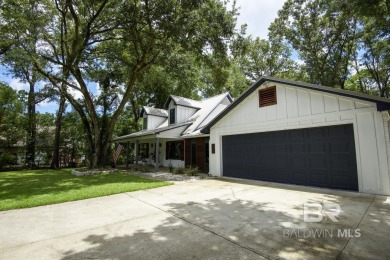 Located just one mile from downtown Fairhope, this 4BR/3.5BA