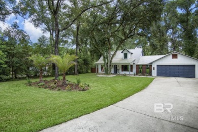 Located just one mile from downtown Fairhope, this 4BR/3.5BA