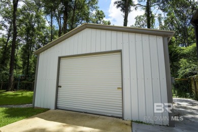 Located just one mile from downtown Fairhope, this 4BR/3.5BA